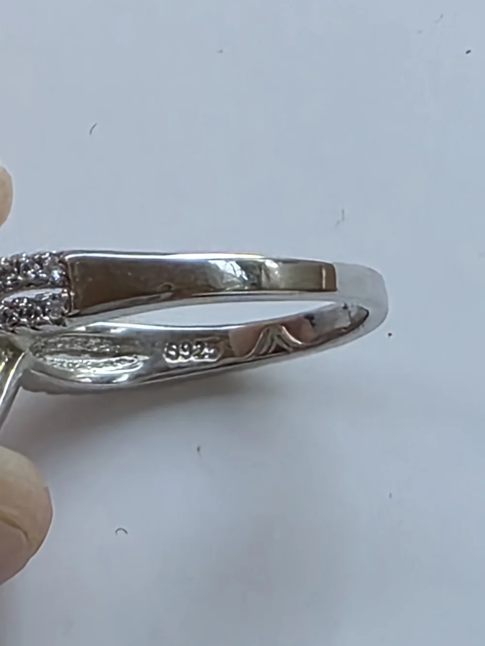 Sterling-Inspired Silver Ring with Pear-Shaped Red Gem and Pavé Halo